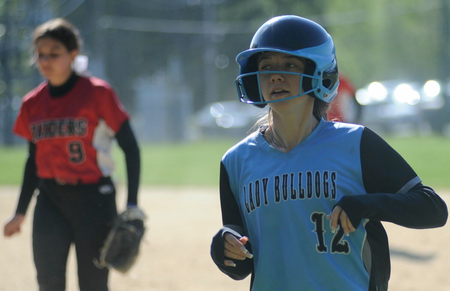 Score one for the home team. Sullivan West’s Hannah Abplanalp crosses the plate. Port Jervis shortstop Charlotte Rivera is pictured in the background.